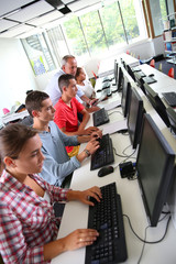 Group of young people in computing class