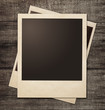 polaroid photo frames on wooden grunge background