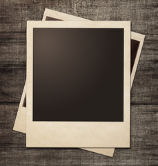 Sticker - polaroid photo frames on wooden grunge background