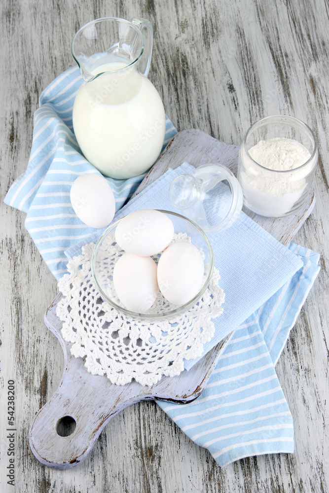 Ingredients for dough on wooden table close-up
