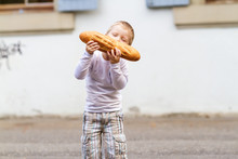 Three Years Old Boy Eating Bread
