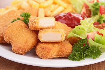 Canvas Print - chicken nuggets,french fries and salad