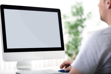 young man working on computer