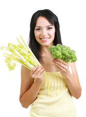 Wall Mural - Girl with fresh broccoli and celery isolated on white