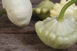 Ripe pattypan squash on a wooden old table