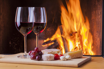 delicious cheese and wine at the fireplace