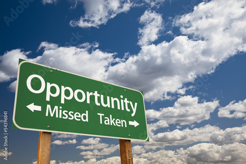 Fotografía Opportunity Missed and Taken Green Road Sign and Clouds