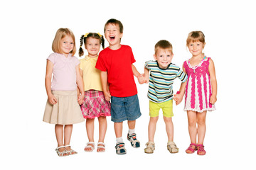 Group of little children holding hands and smiling.