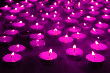 Wall Mural - Burning candles on dark background