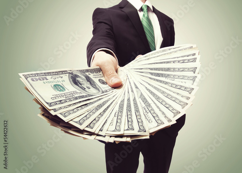 Fotografía Business Man Displaying a Spread of Cash
