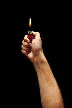 Man Hand Holding Burning Lighter