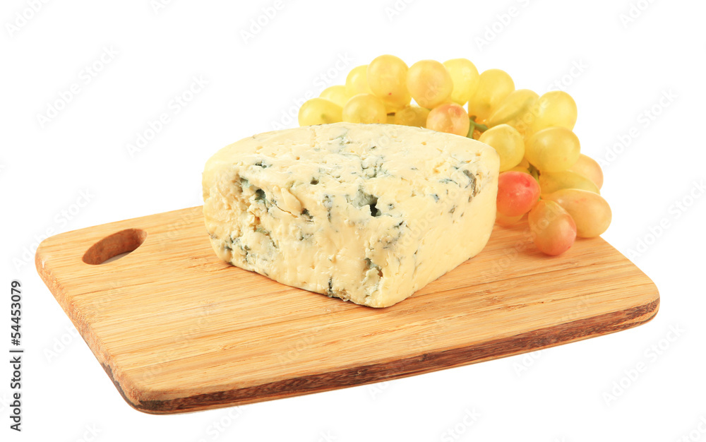 Tasty blue cheese and grape on cutting board, isolated on white