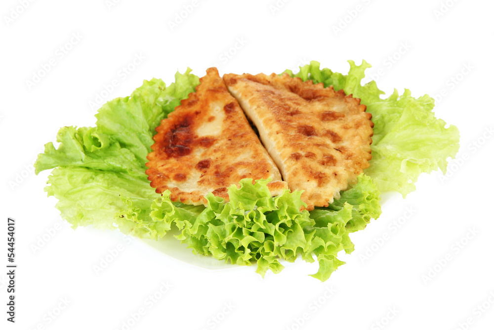 Tasty chebureks with fresh herbs on plate, close-up