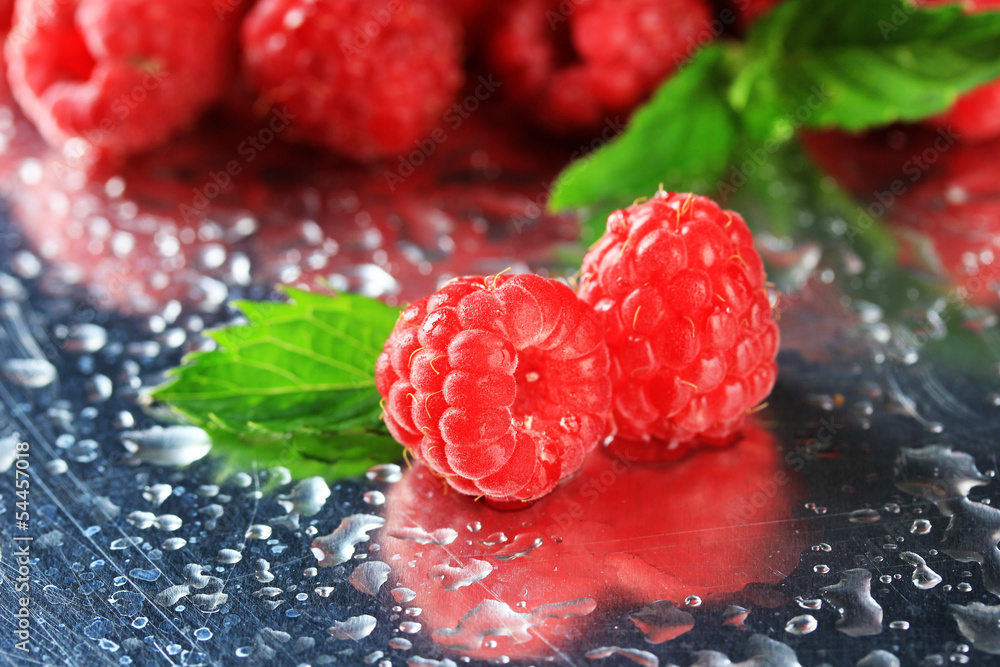 Ripe sweet raspberries with drops, close up