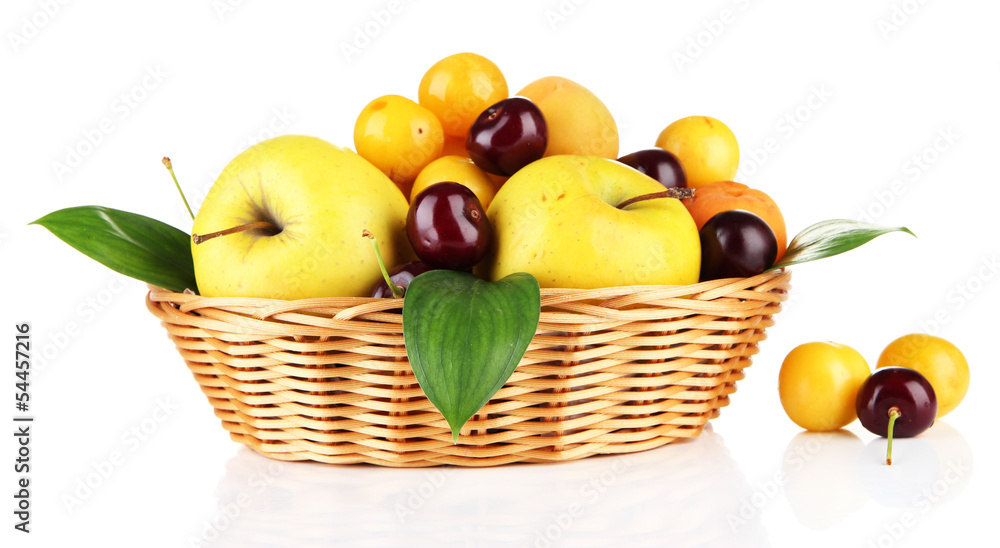 Bright summer fruits in basket isolated on white