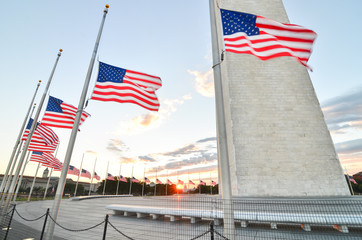 U.S. national flags and Washington Monument during sunset  - Washington D.C. United States of America