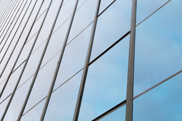 background of blue sky reflect on glasses from  business buildin