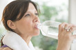 © tmc_photos - Woman Drinking Water After Exercise