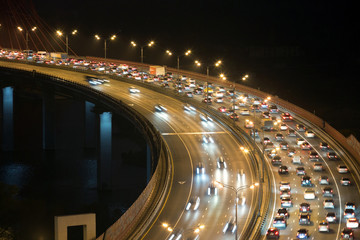 Night traffic on highway with motion cars