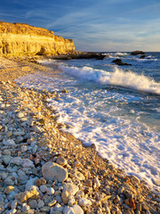 Wall Mural - Waves and pebbles on the seashore. Beautiful summer composition