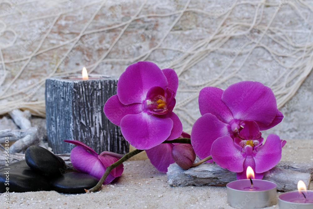 czarne-kamienie-bazaltowe-swieczki-i-fioletowa-orchidea