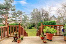 Wood Deck With Railings And Spring Back Yard Garden