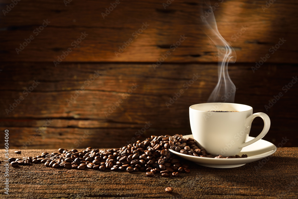 Coffee cup and coffee beans on old wooden background - obrazy, fototapety, plakaty 