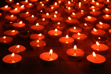 Wall Mural - Burning candles on dark background