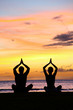 © Maridav - Yoga meditation - silhouettes of people at sunset