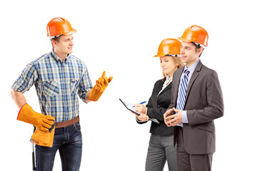 Wall Mural - Manual worker having a conversation with architects