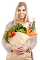 Wall Mural - Beautiful woman carrying vegetables