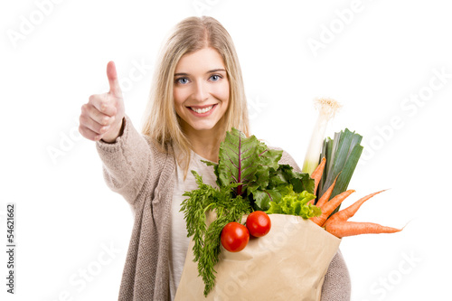 Naklejka - mata magnetyczna na lodówkę Beautiful woman carrying vegetables