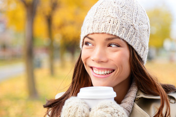 Wall Mural - Autumn / fall woman drinking coffee looking