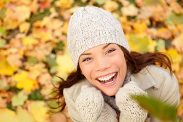 Wall Mural - Autumn woman happy with colorful fall leaves