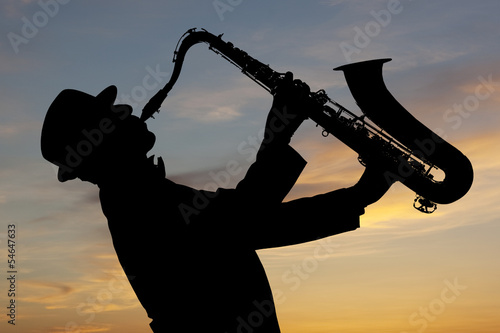 Naklejka - mata magnetyczna na lodówkę Saxophonist at sunset