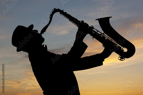 Fototapeta do kuchni Saxophonist at sunset