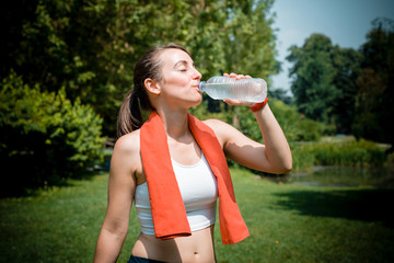 Wall Mural - beautiful woman fitness drinking water