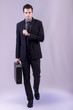 © Mauro Rodrigues - young business man on grey