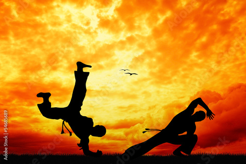 Obraz na płótnie canvas Capoeira o zachodzie słońca