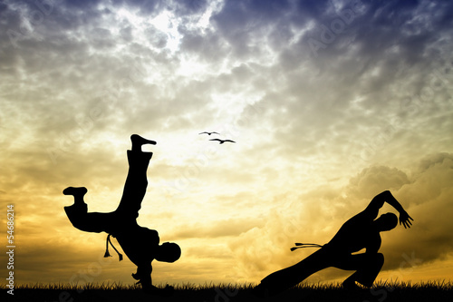 Fotoboard na płycie Sylwetka capoeira o zachodzie słońca