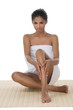 © BlueSkyImages - SPA women. Beautiful young women wrapped in towel touching her l