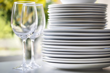White Plates And Wine Glasses