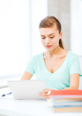 Wall Mural - smiling student girl with tablet pc