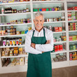 Store Owner Smiling In Supermarket