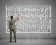 © Sergey Nivens - Businessman solving labyrinth problem