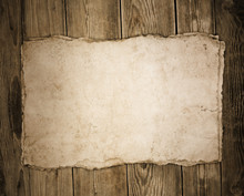 Old Paper On The Wood Background