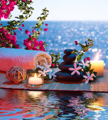 Wall Mural - Candles - black stones and tiare - Bougainvillea on water