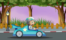 A Boy In His Blue Racing Car With A White Star