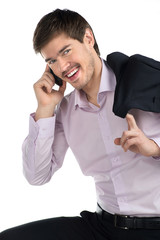 Wall Mural - Successful businessman. Cheerful young man talking at phone and