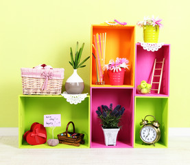 Wall Mural - Shelves of different bright colors with decorative addition